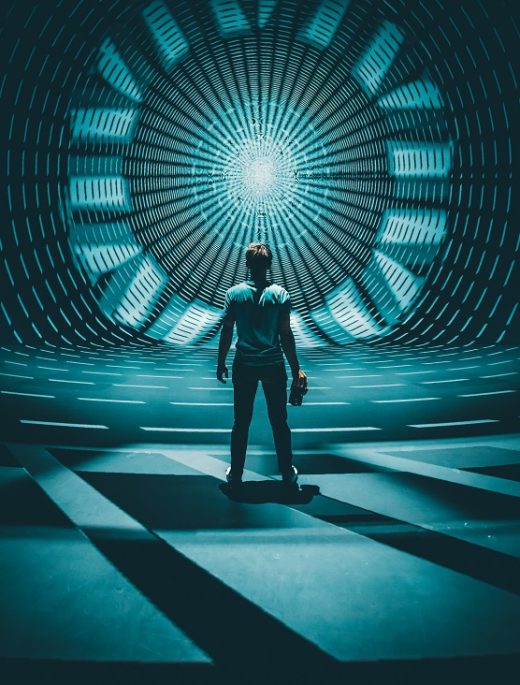 Man standing in front of symmetrical light projection
